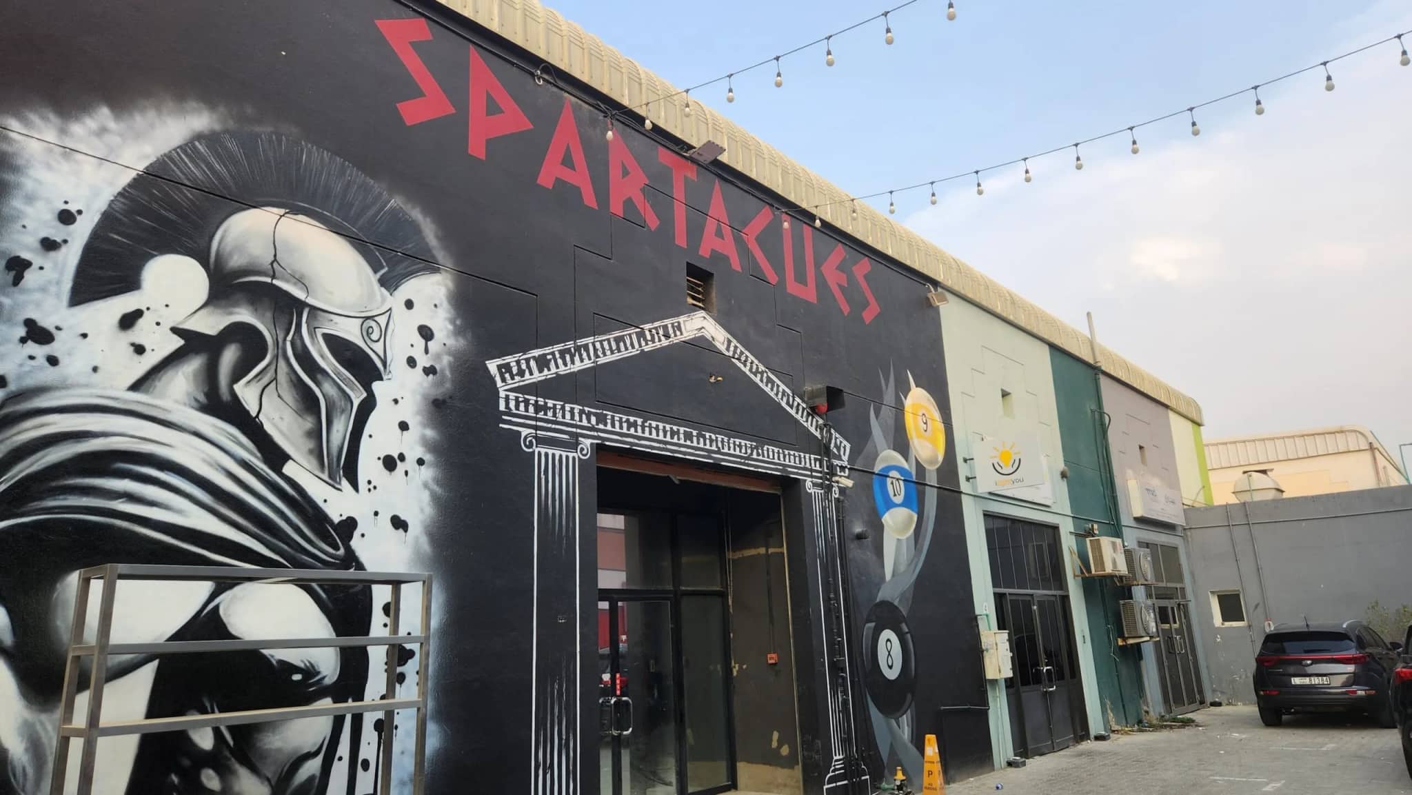 The Spartacues entrance, a Spartan mural painted across the front of the building